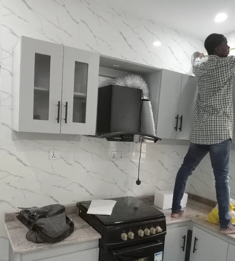 image of a technician working in a modern kitchen