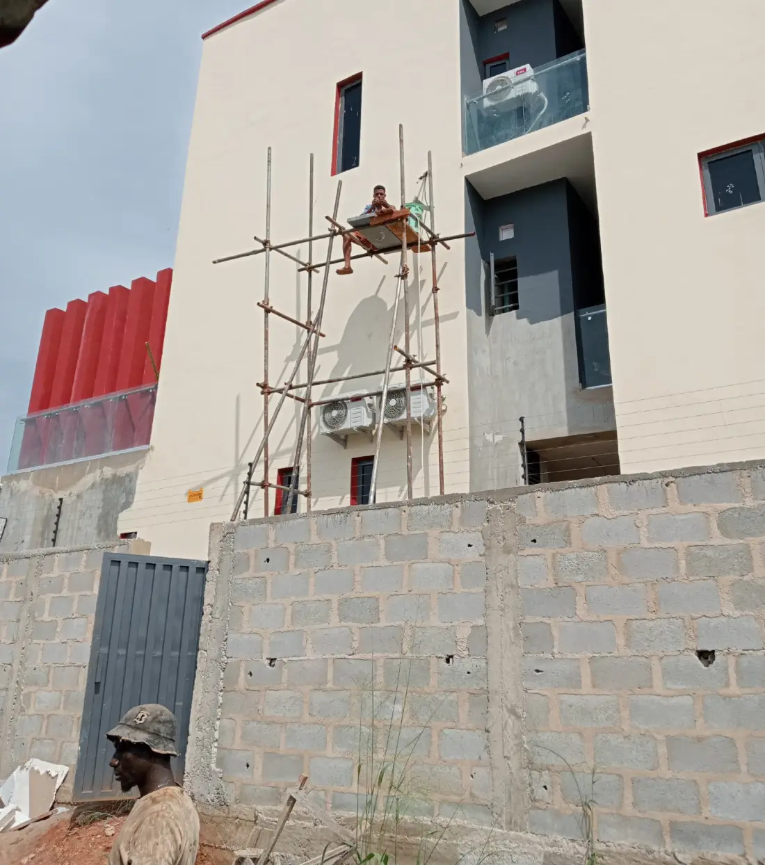 a view of an house with three outdoor units of air conditioning installed